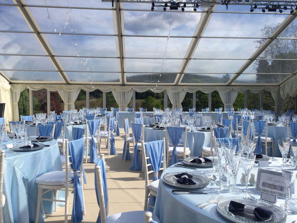 Powder Blue table linen, Silver charger plates paired with Navy Essential bowtie napkins, Ivory Chiavari Chairs with White Essential seat pads and Powder Blue Valentina weaves at Ballogie House