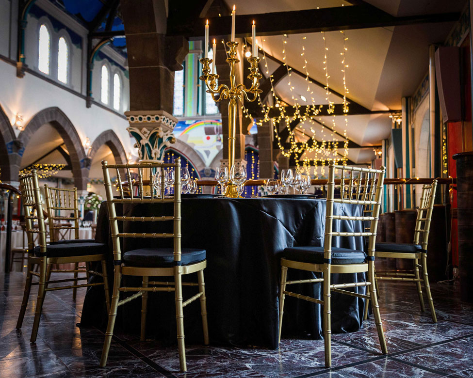 Nero Verona table linen, Gold Candelabra and Gold Chiavari Chairs with Noir Taffeta cushioned seat pads