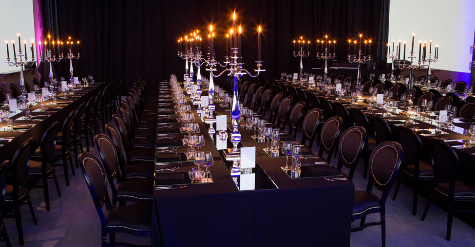 Black Essential table linen and napkins, Silver Square Base Candelabras, Smoke Glasses and Black French Chairs