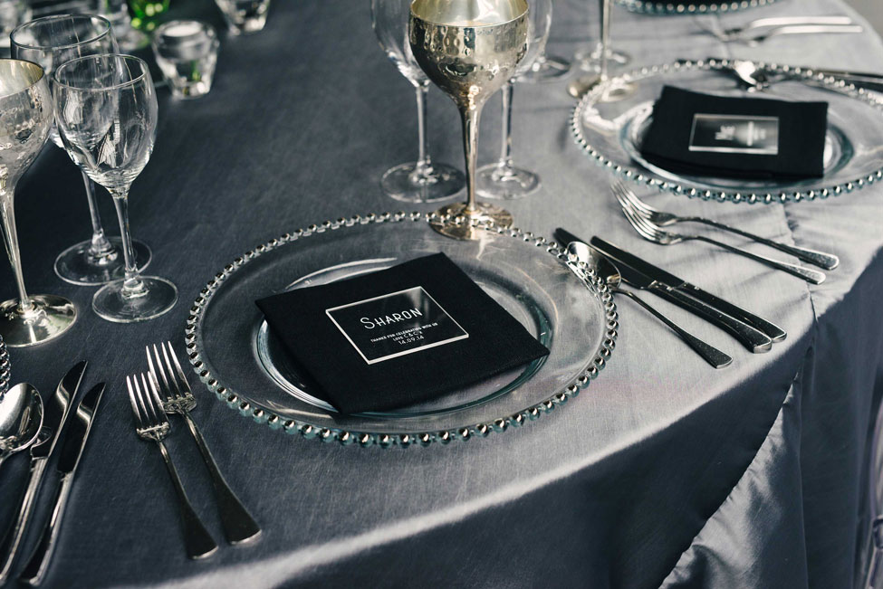 Super Silver table linen, Silver Beaded charger plate paired with Black Essential napkin and Pewter Goblets
