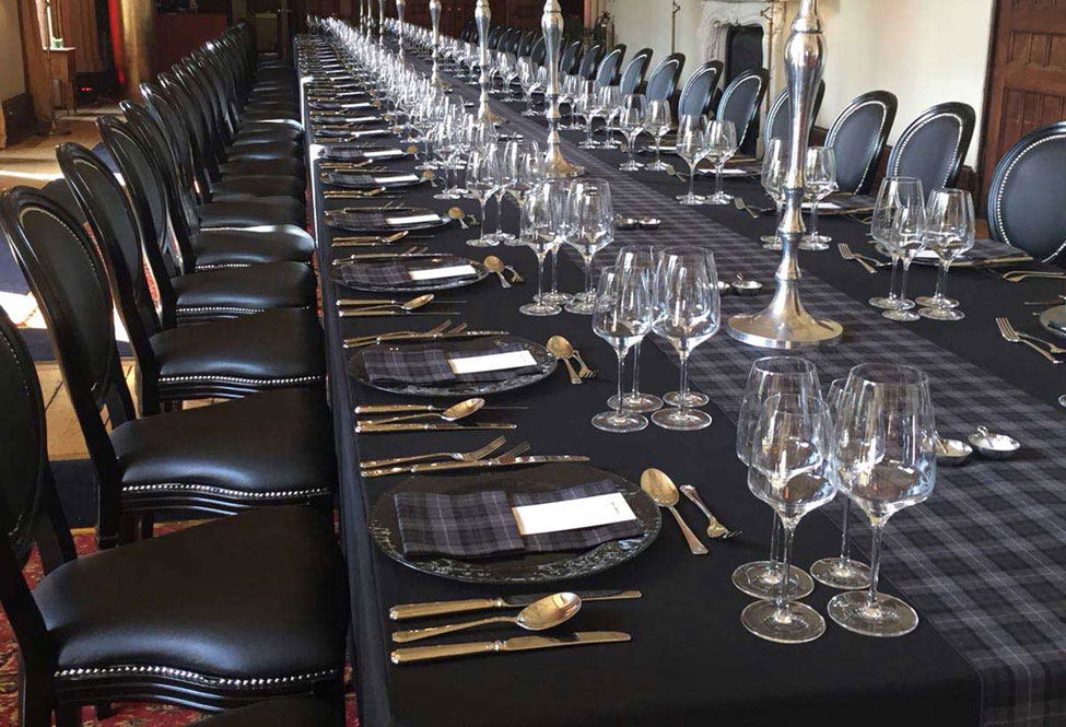 Arran Tartan runners, Smoke Grey charger plate with Arran Tartan napkins, Black Essential table linen and Black French Chairs