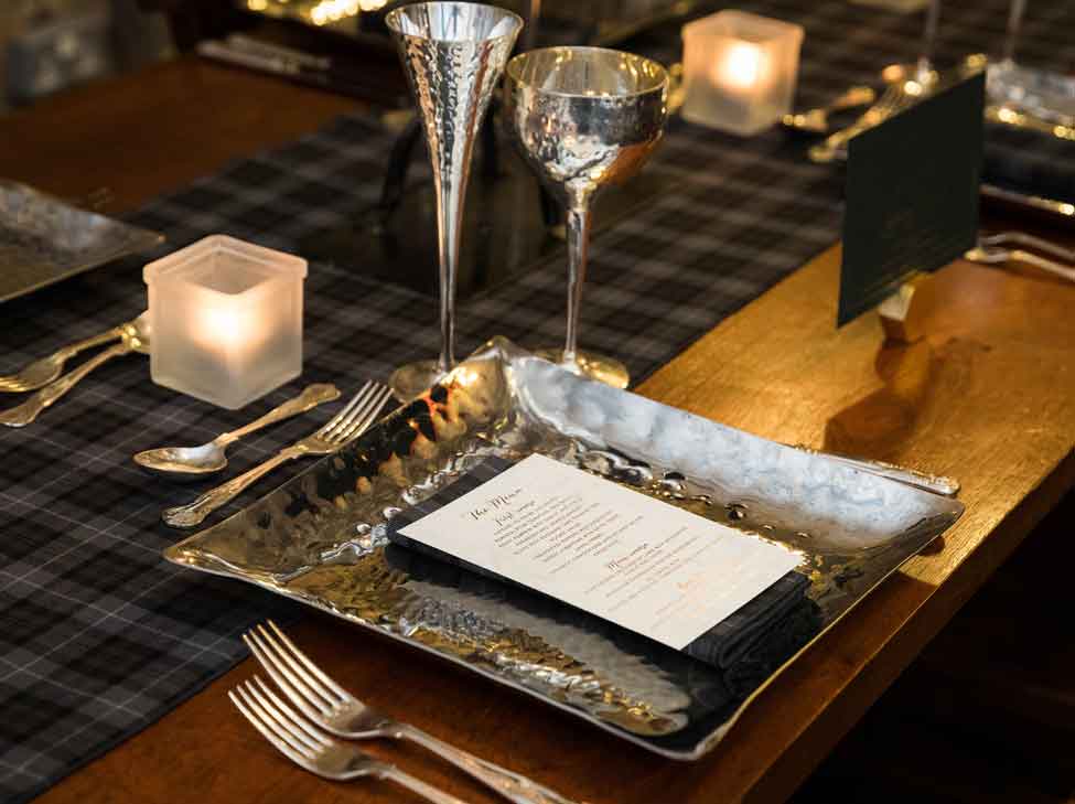 Arran Tartan runners and napkins, Pewter charger plate, goblet and flute.