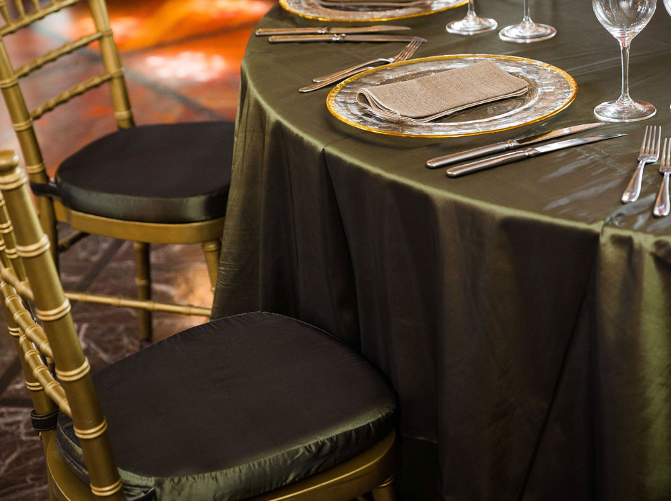 Woodland Taffeta table linen, Gold Trim charger plate with Malted Wheat napkin, Gold Chiavari Chairs with Woodland Taffeta seat pad