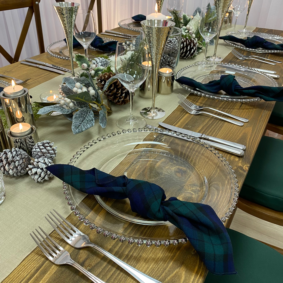 Styling features: Crossback chairs w/green Essential pads, caramello Gelato runner & Blackwatch tartan napkins, silver Beaded chargers & Pewter chalice.