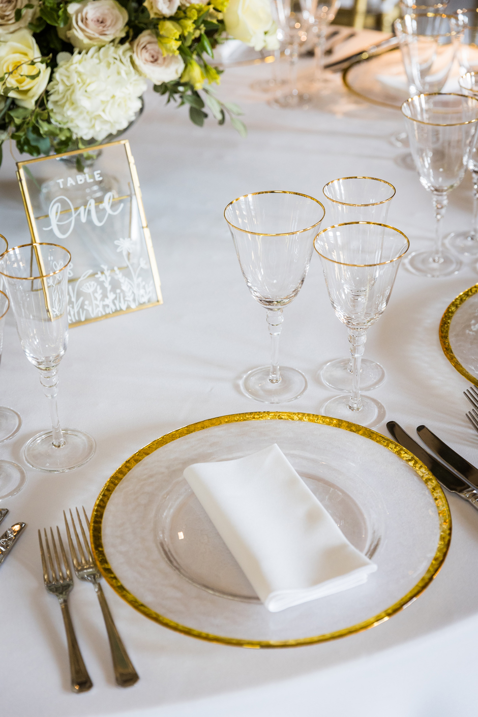 Gold trim glasses with white Essential linen & gold trim charger plate